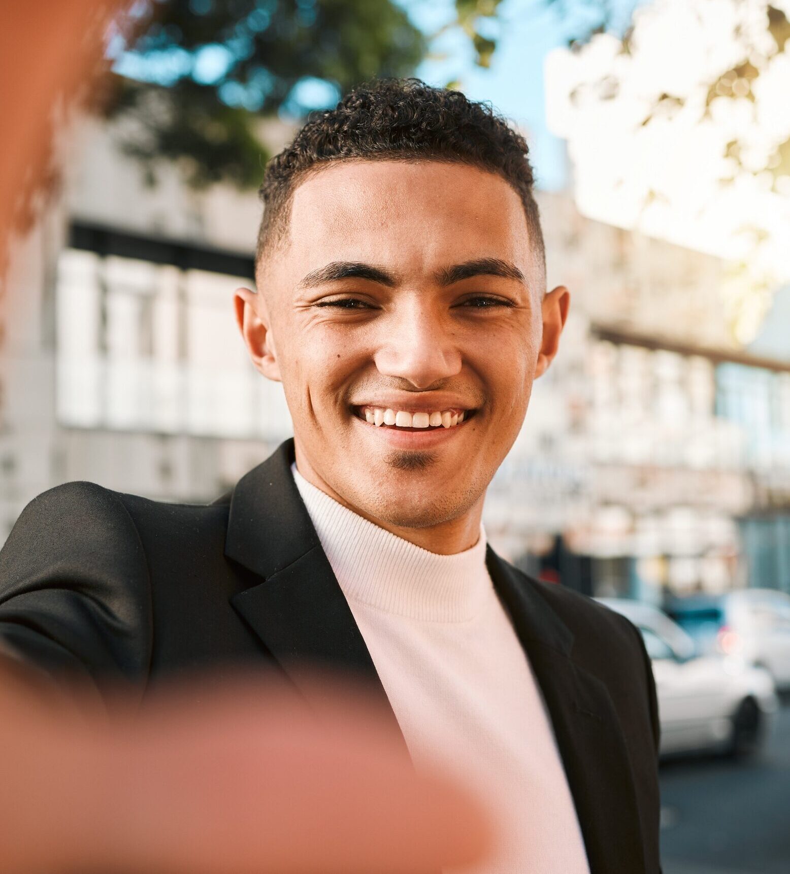 Selfie, happy and portrait of business man in city for social media, profile picture and blog post.